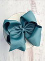 Large blue bow on a white background