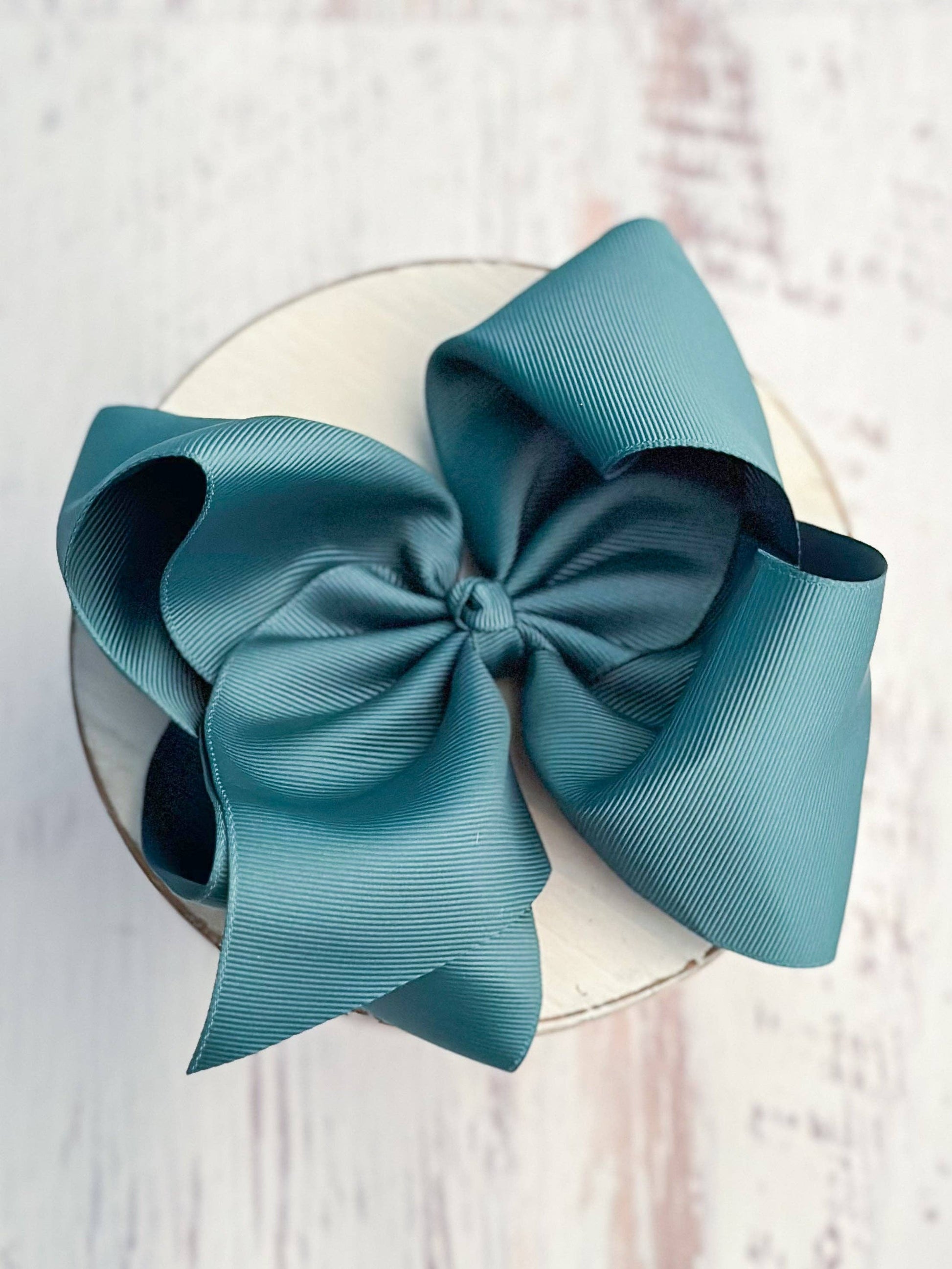 Large blue bow on a white background