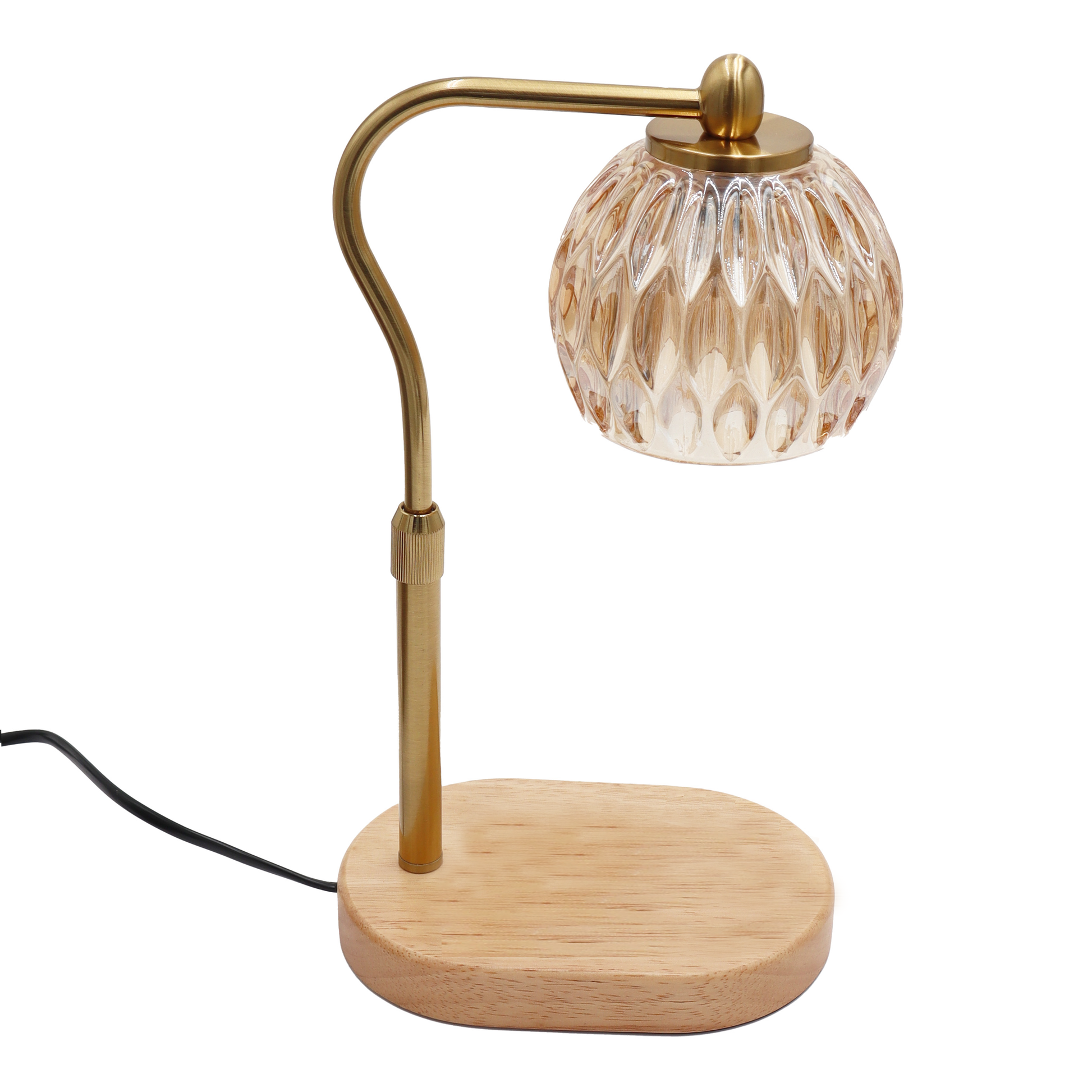 Candle warmer lamp with glass shade and brass arm on a white background