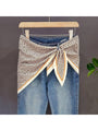 Leopard print triangle bandana with cream and green contrast border, tied at center