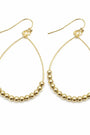 Gold hoop earrings with bead detailing on a white background