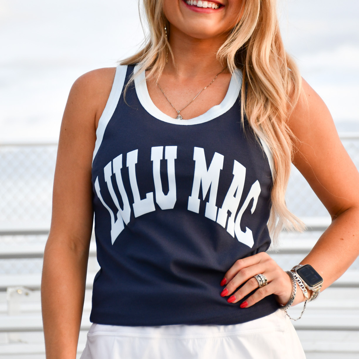 Navy graphic tank top with light blue trim and large abstract lettering