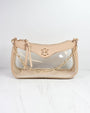 Beige handbag with clear section and gold chain strap on a white background