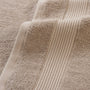 Close-up of beige textured fabric with ribbed pattern