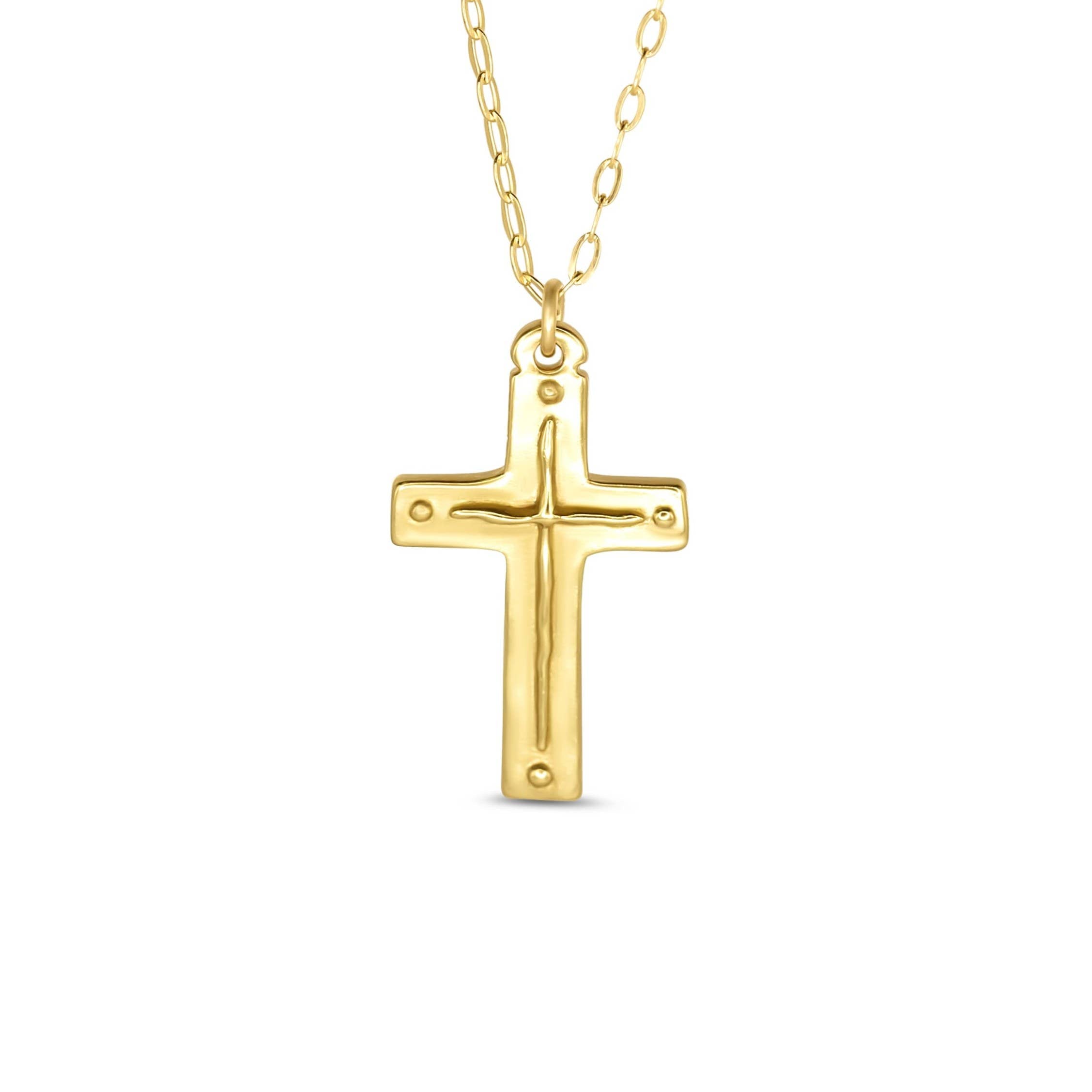 Gold cross necklace on a white background