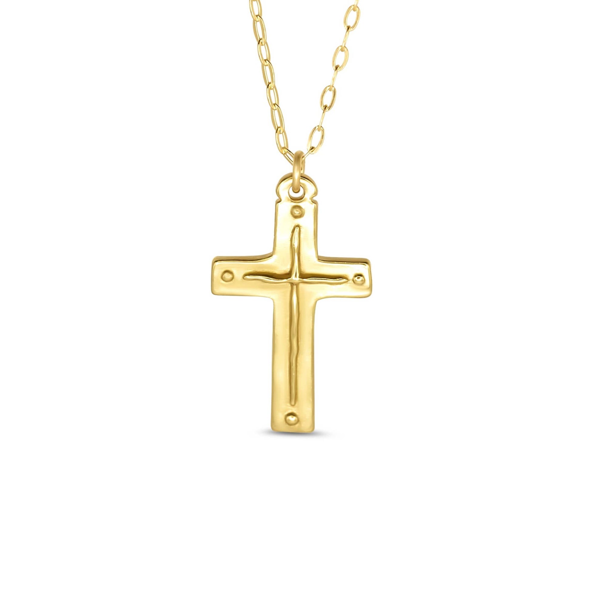 Gold cross necklace on a white background