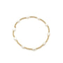 Pearl bracelet with gold accents on a white background