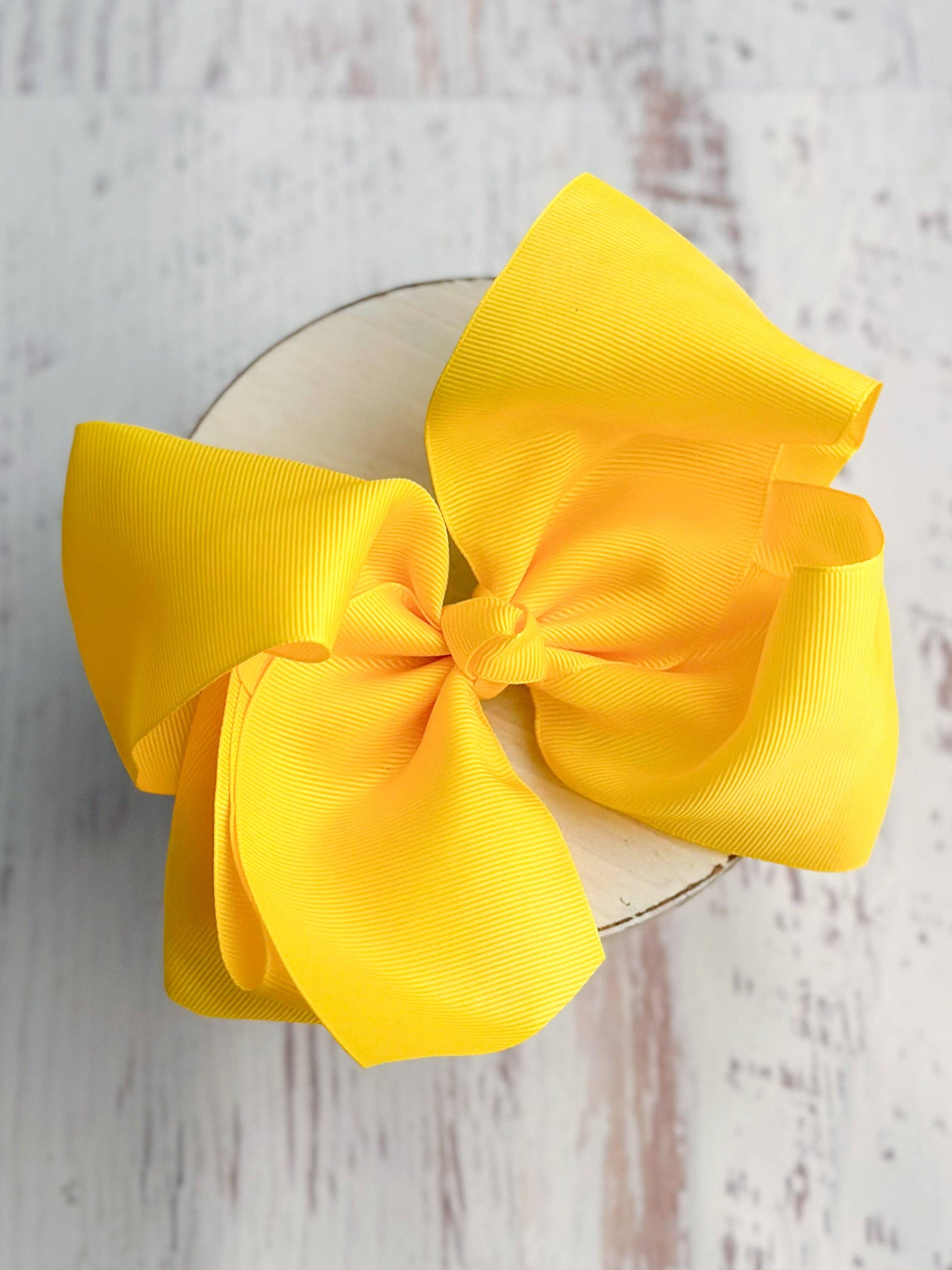 Large yellow bow on a white background