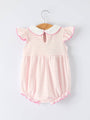 Pink striped baby romper with white collar on a hanger against a light gray background