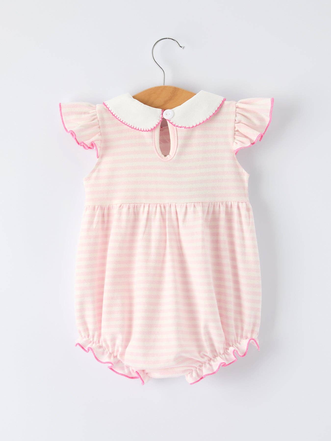 Pink striped baby romper with white collar on a hanger against a light gray background