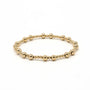 Gold beaded bracelet on a white background