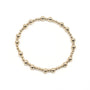 Gold beaded bracelet on a white background