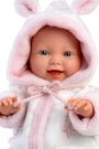 Baby doll in a pink bunny outfit with a white background