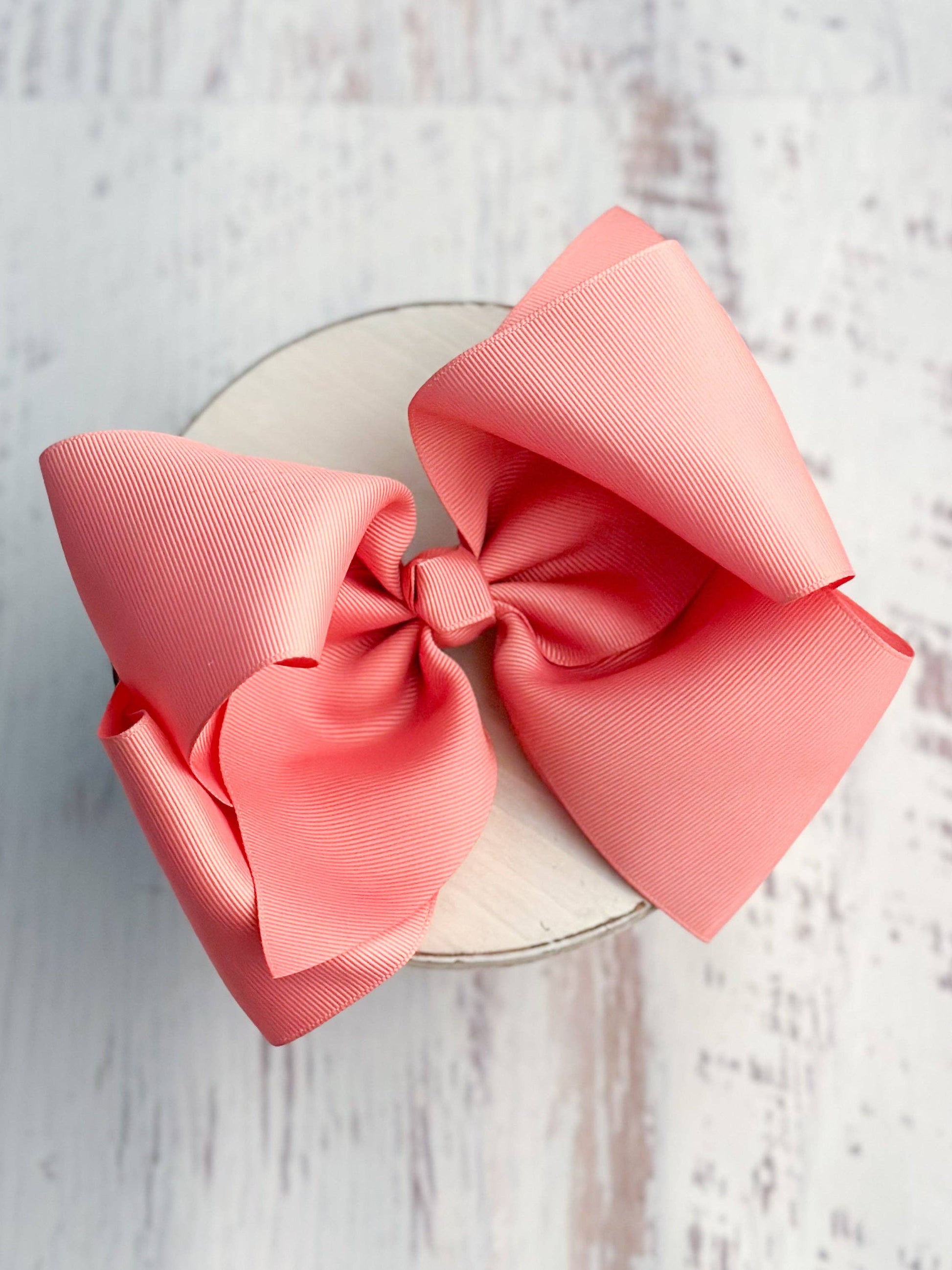 Large pink bow on a white background