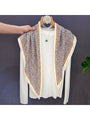 Leopard print scarf bandana with cream base, green and peach contrast borders on hanger