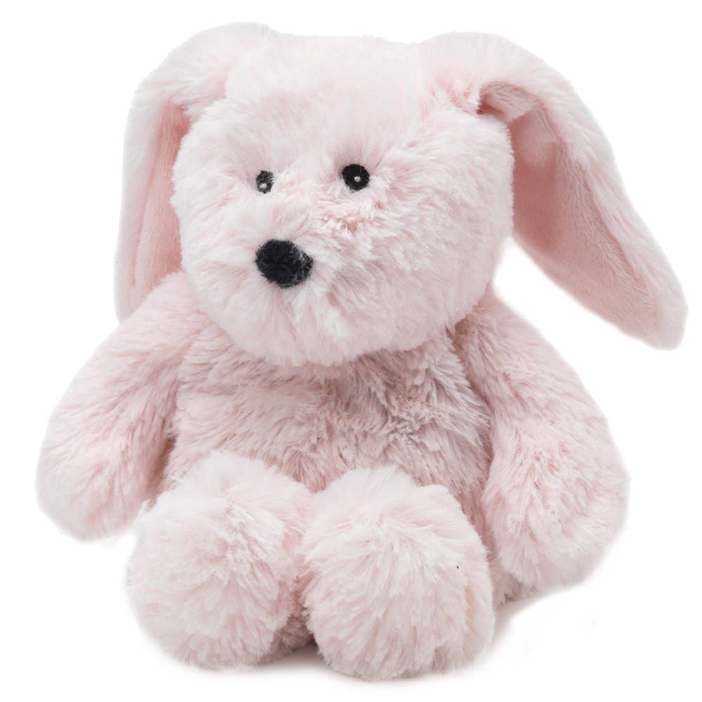 Pink plush bunny toy on a white background