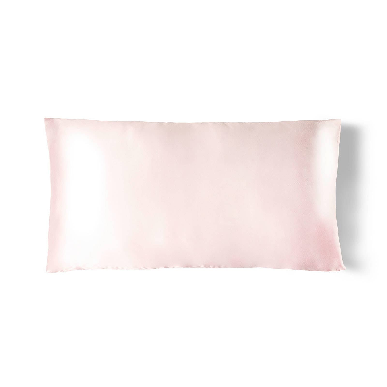 Silky pillowcase with a soft pink gradient on a white background