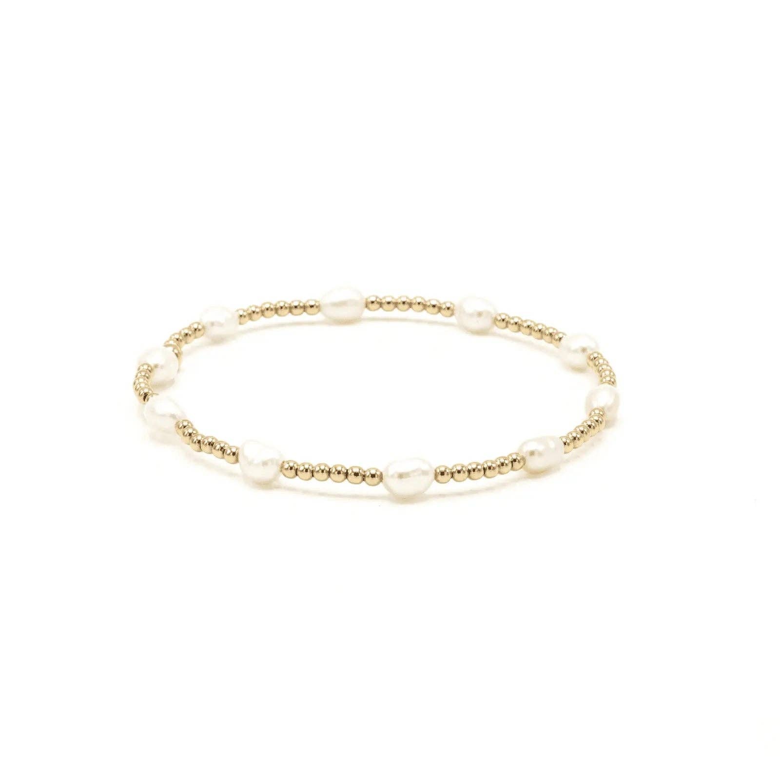 Gold bracelet with pearls on a white background