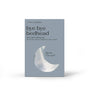 Silky satin pillowcase packaging with moon design on a light gray background