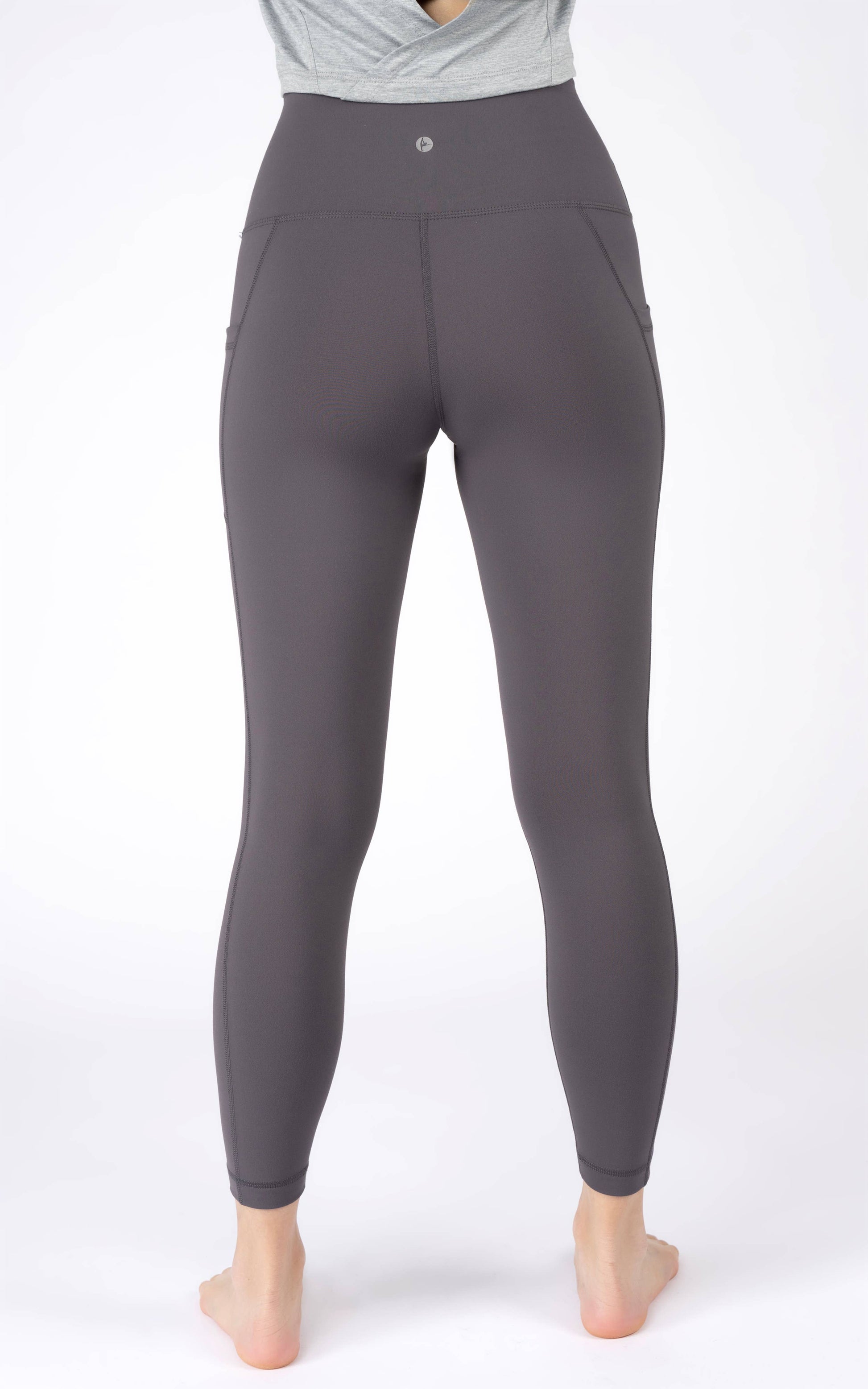 Black leggings worn by a person on a white background