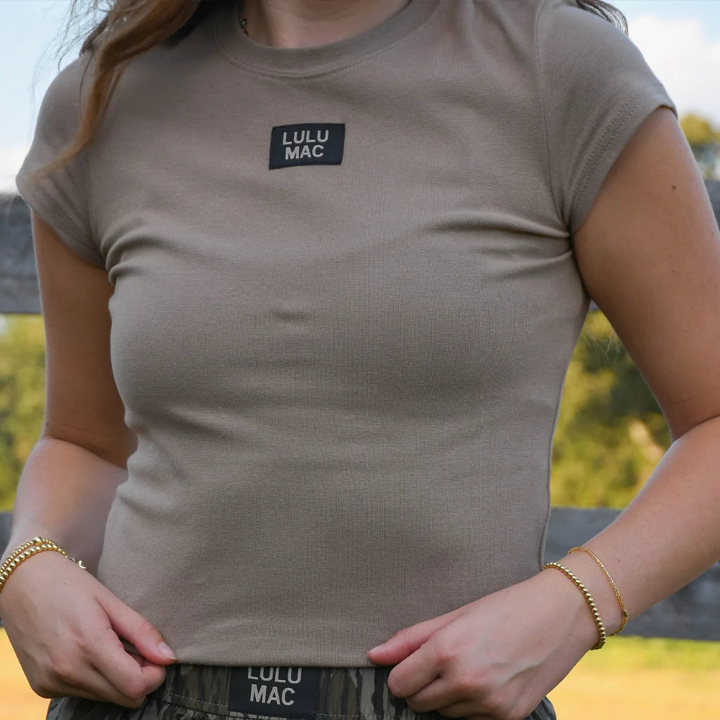 Lulu Mac dark taupe babydoll top with short sleeves and chest logo