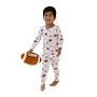A toddler wearing a white long-sleeve pajama set with a colorful cartoon pattern, holding a small football against a plain white background.