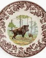 Decorative plate with a bear design in a natural setting