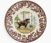 Decorative plate with a bear design in a natural setting