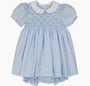 Light blue dress with white collar on a plain background