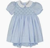 Light blue dress with white collar on a plain background
