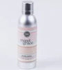 Silver spray bottle with a label on a white background