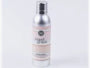 Silver spray bottle with a label on a white background