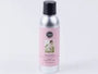 Spray bottle with a pink label on a white background