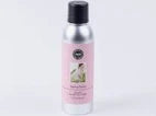 Spray bottle with a pink label on a white background