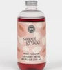Bottle of Sweet Grace pink flower body wash with a floral design on the label.
