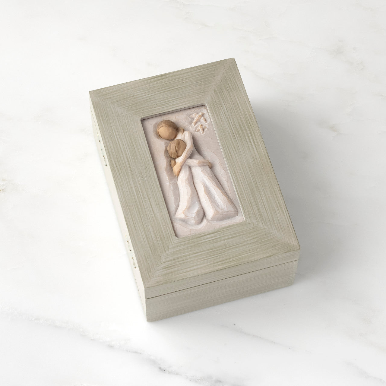 Decorative box with a mother and daughter figure on a white background