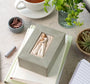 Decorative box with a Mother and daughter figure on a desk with stationery items