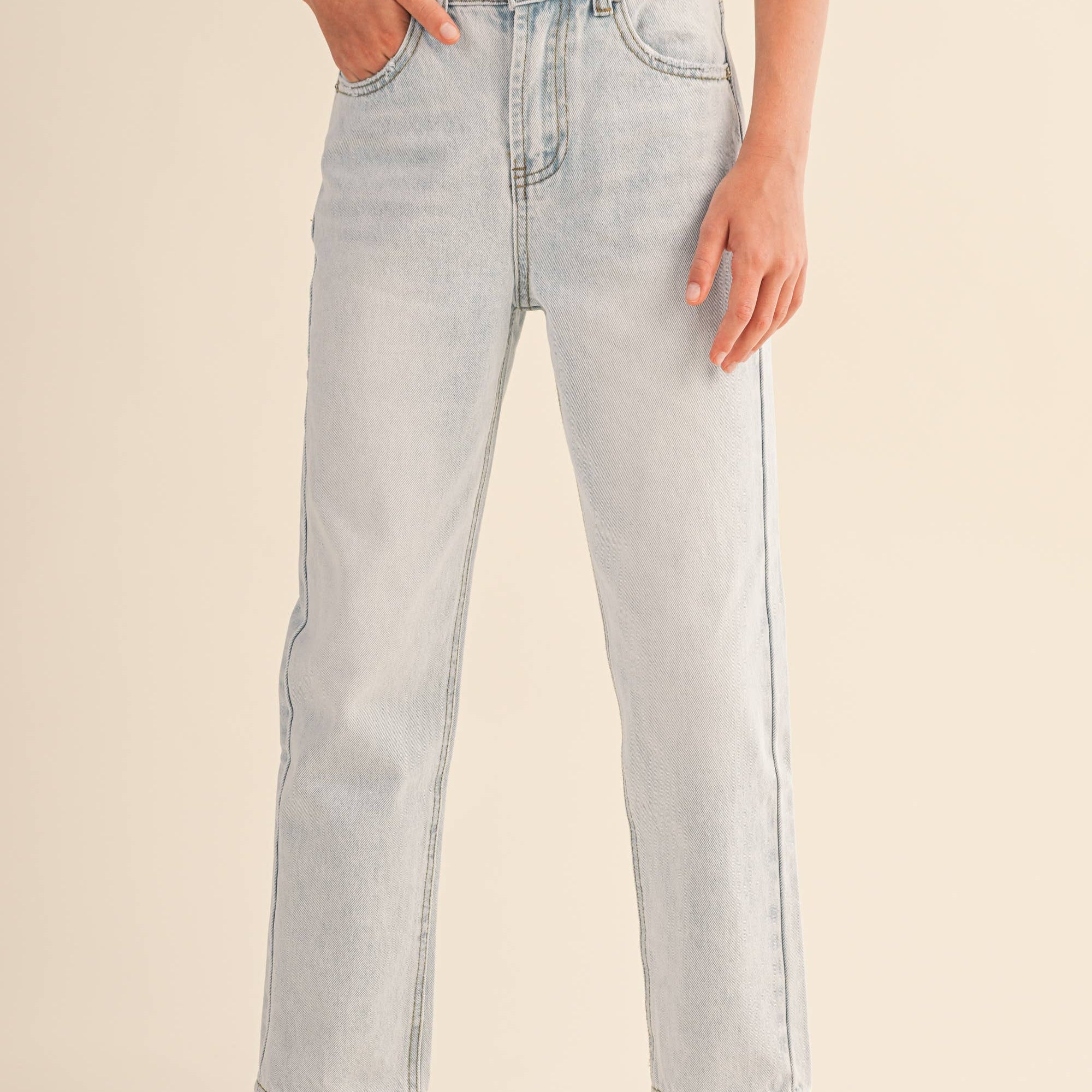 Person wearing light blue jeans 