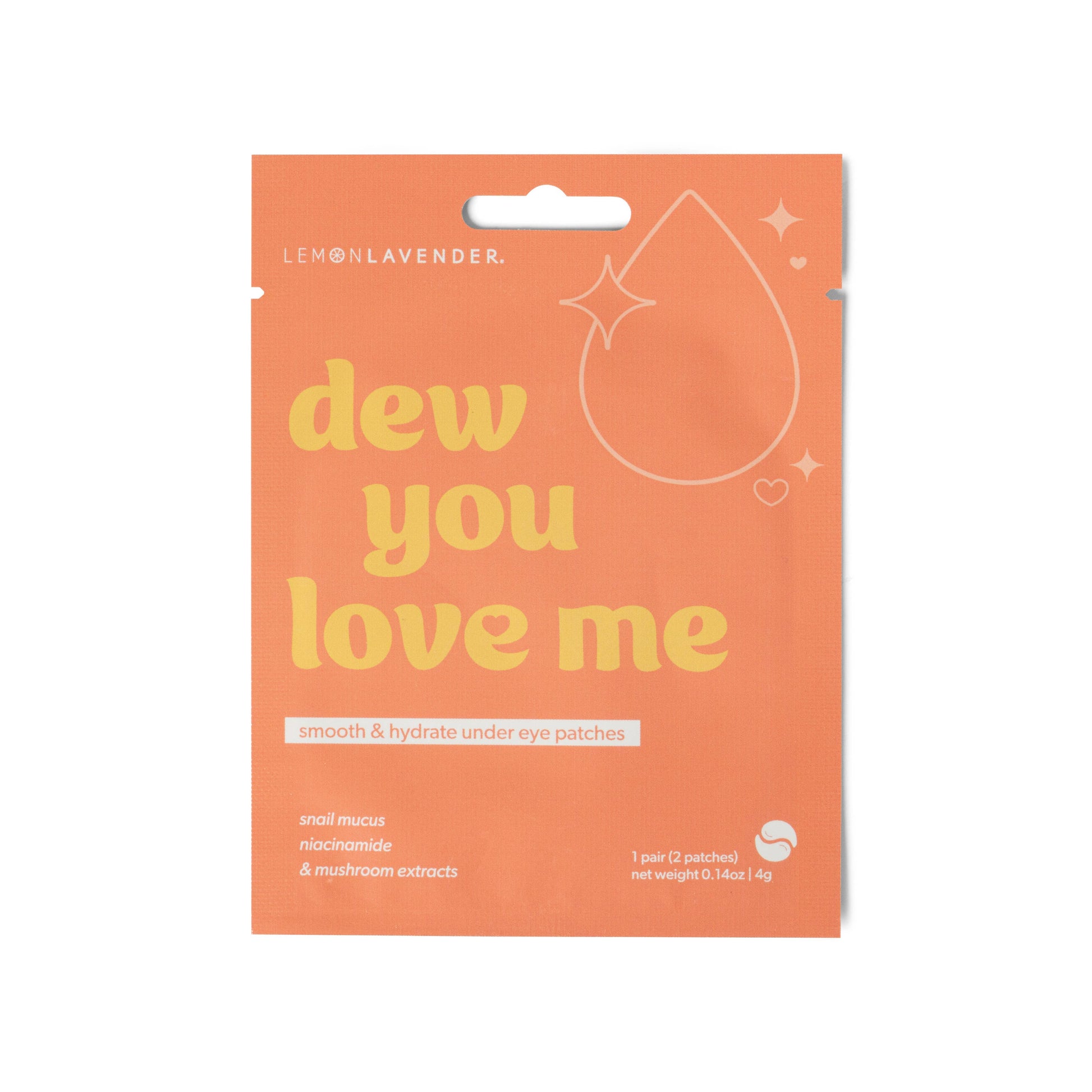 Orange packaging of 'dew you love me' eye patches with lemon lavender branding.