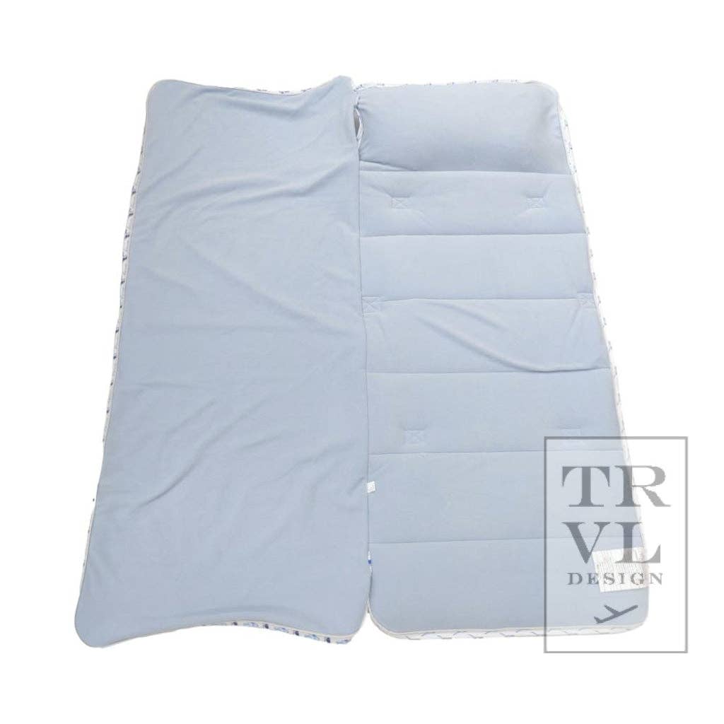 Light blue quilted nap mat on a white background with 'TRVL DESIGN' branding.