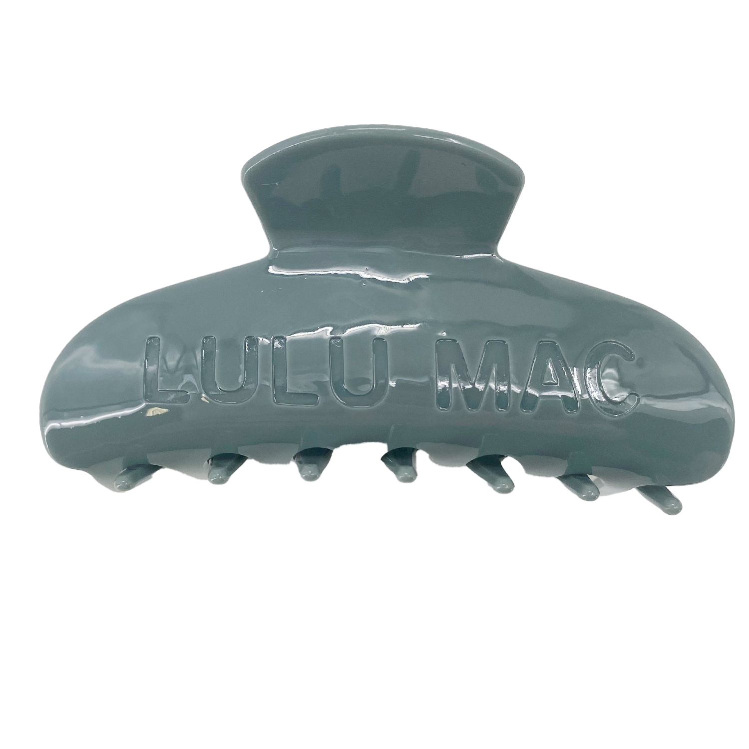 Green hair clip with 'Paula-Mac' branding on a white background