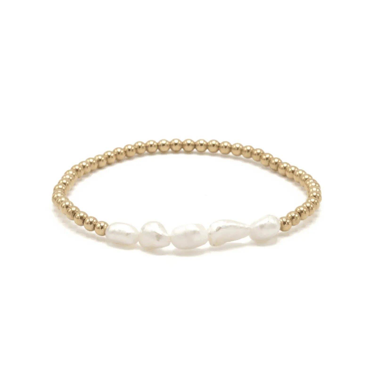 Gold and pearl bracelet on a white background
