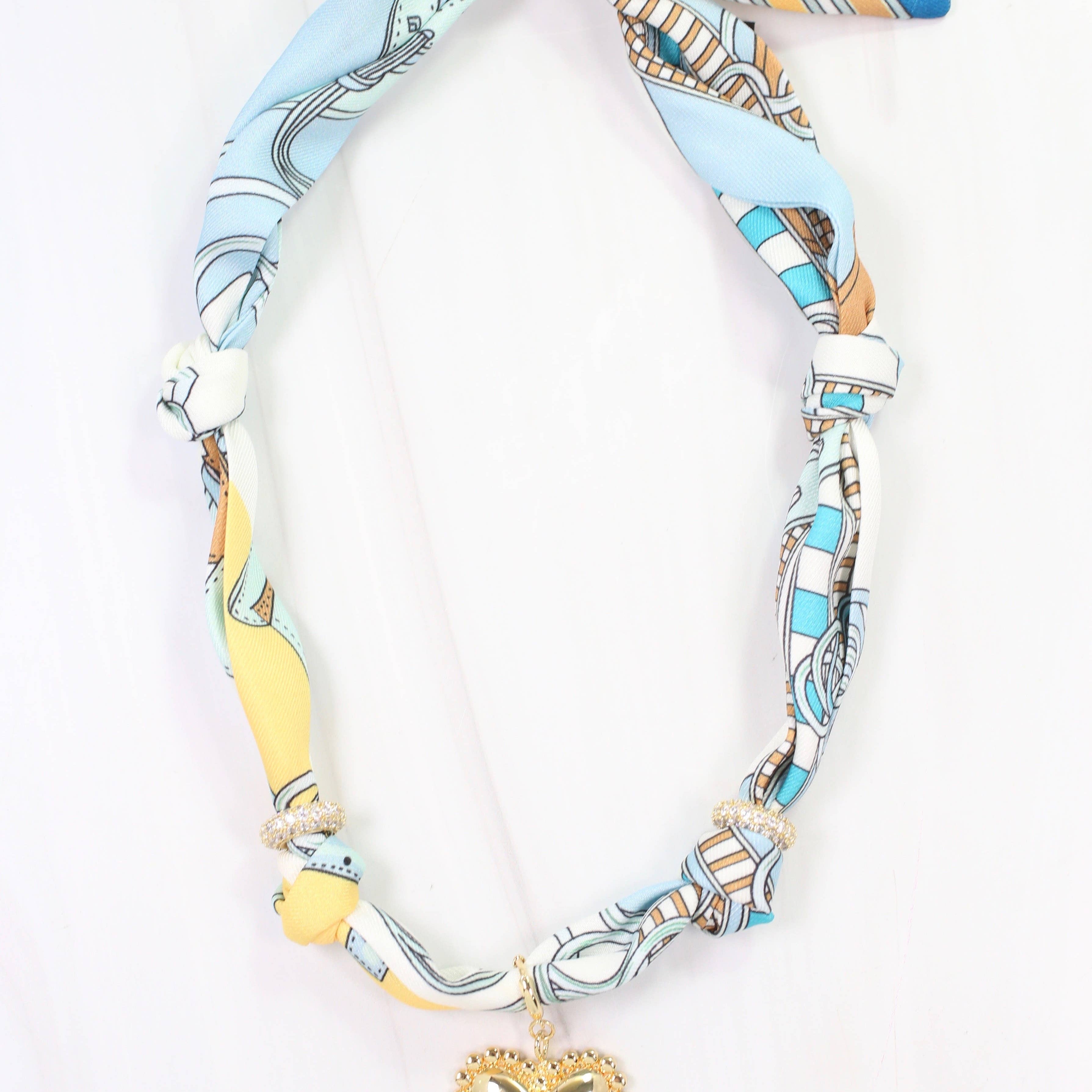 Necklace with a heart pendant on a white background