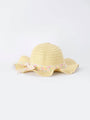 Yellow straw hat with a floral band on a white background
