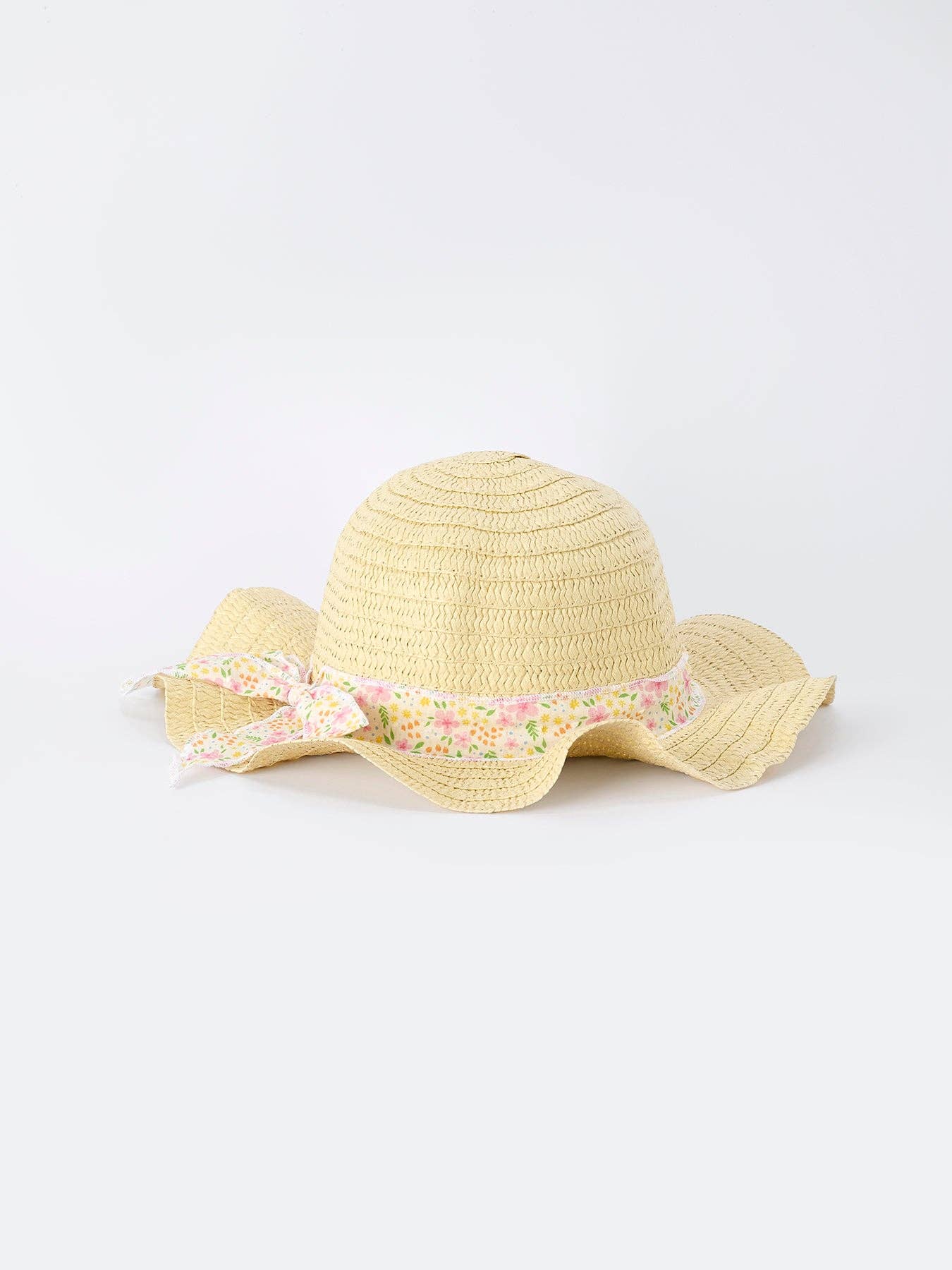 Yellow straw hat with a floral band on a white background