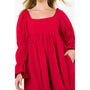 Red dress with puffed sleeves on a white background
