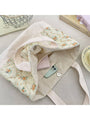 Quilted floral tote bag open top, showing inner lining and light blue flower fabric