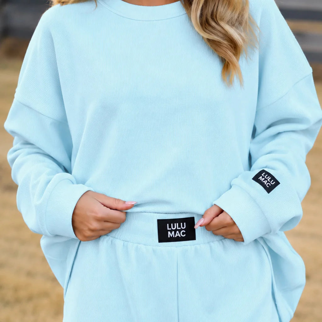 Ice blue waffle long-sleeve top with crew neck and Lulu Mac waist patch