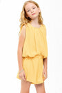 Young girl wearing a yellow set on a white background