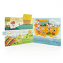 Children's book open to a page with illustrations of Noah's Ark and animals.